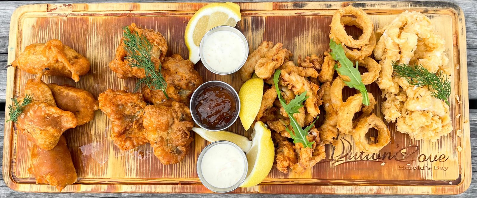 Seafood platter with calamari, hake nuggets and dips